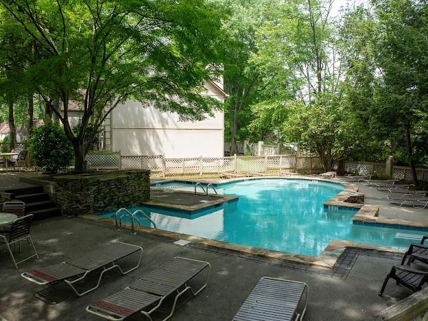 904 Bridge Ln SE, Smyrna, GA 30082 - view of swimming pool featuring fence and a patio