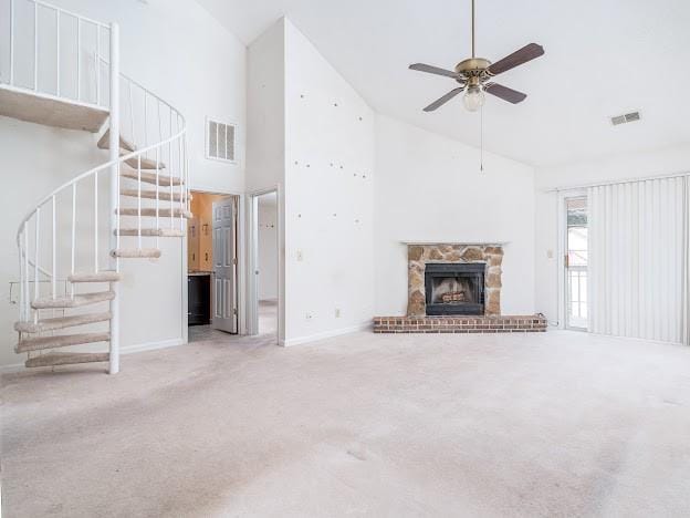 904 Bridge Ln SE, Smyrna, GA 30082 - unfurnished living room featuring high vaulted ceiling, stairway, carpet, ceiling fan, and baseboards