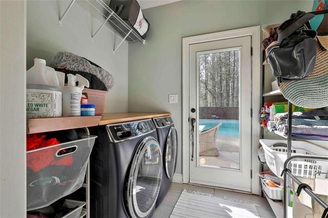 laundry area with washing machine and dryer and laundry area
