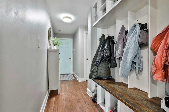 mudroom featuring baseboards and wood finished floors