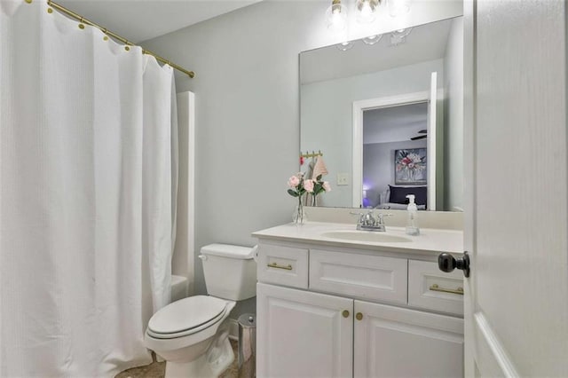 full bathroom featuring shower / bath combination with curtain, ensuite bathroom, vanity, and toilet