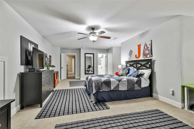 bedroom with visible vents, baseboards, and light carpet