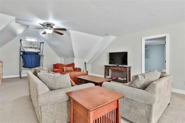 living room with vaulted ceiling, baseboards, light colored carpet, and ceiling fan