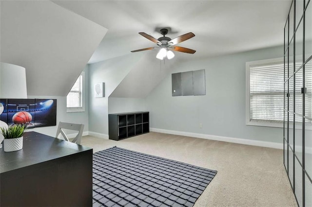 bonus room featuring carpet, lofted ceiling, baseboards, and ceiling fan