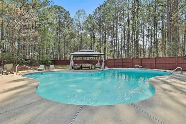 view of swimming pool featuring a fenced backyard, a gazebo, a patio area, and a fenced in pool