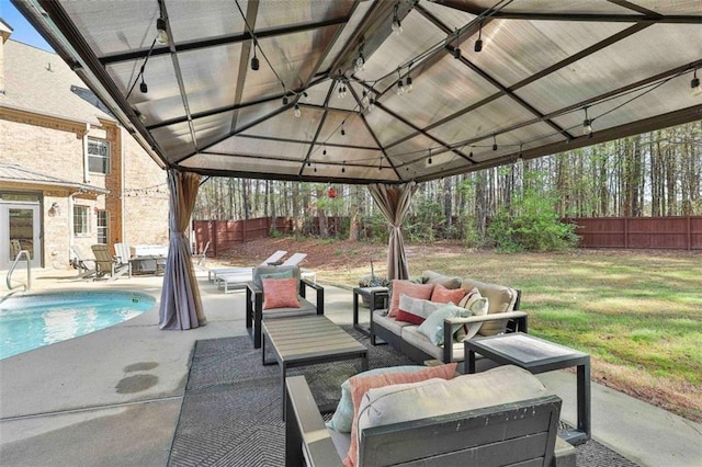 view of patio featuring a fenced backyard, an outdoor pool, a gazebo, and an outdoor living space