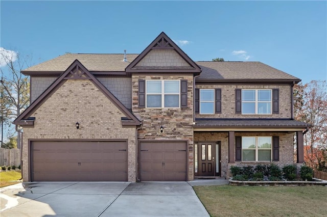 view of front of property featuring a shingled roof, driveway, a front lawn, and brick siding