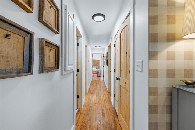 hallway with light wood-style floors