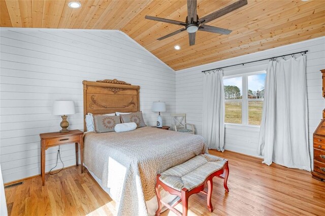 bedroom featuring visible vents, wood ceiling, light wood-type flooring, and vaulted ceiling