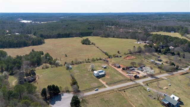 bird's eye view featuring a rural view and a view of trees