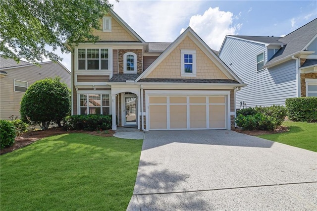 5040 Stonehaven Vw, Cumming, GA 30040 - craftsman inspired home featuring concrete driveway, a front yard, a garage, and roof with shingles