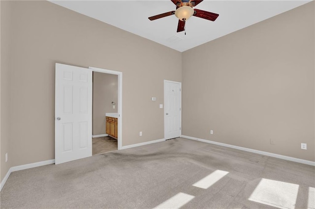 5040 Stonehaven Vw, Cumming, GA 30040 - unfurnished bedroom with light carpet, baseboards, ensuite bath, and a ceiling fan