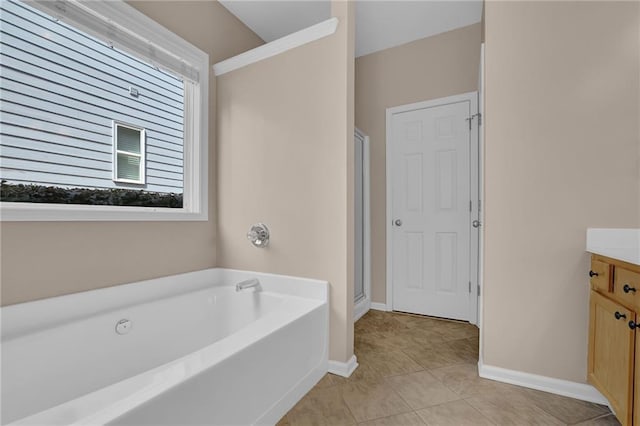 5040 Stonehaven Vw, Cumming, GA 30040 - full bathroom with vanity, a garden tub, tile patterned floors, a shower stall, and baseboards