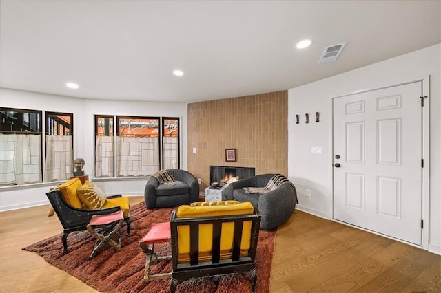 595 Overbrook Dr NW, Atlanta, GA 30318 - living area with wood finished floors, recessed lighting, a warm lit fireplace, and baseboards