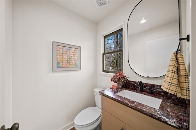 595 Overbrook Dr NW, Atlanta, GA 30318 - half bath with vanity, toilet, and baseboards