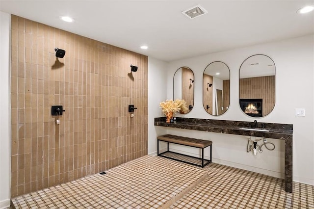 595 Overbrook Dr NW, Atlanta, GA 30318 - bathroom featuring recessed lighting, tiled shower, and a sink