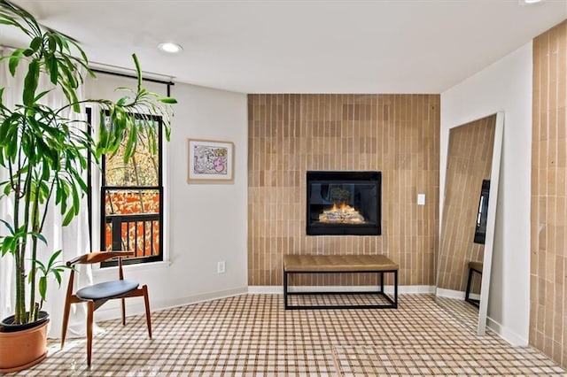 595 Overbrook Dr NW, Atlanta, GA 30318 - sitting room featuring recessed lighting, a glass covered fireplace, carpet flooring, and tile walls