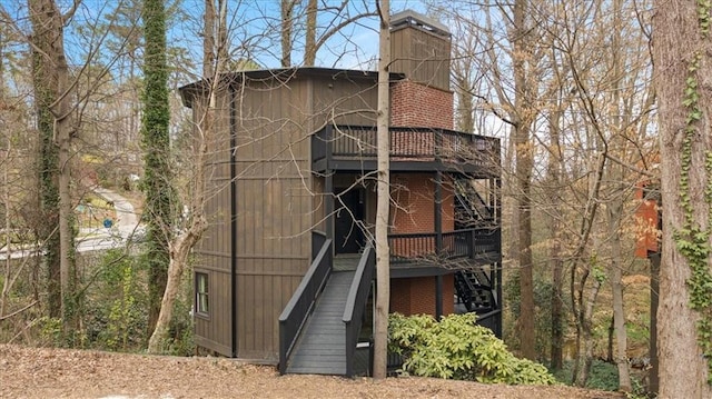 595 Overbrook Dr NW, Atlanta, GA 30318 - view of front of property featuring a chimney, stairway, a wooden deck, and brick siding