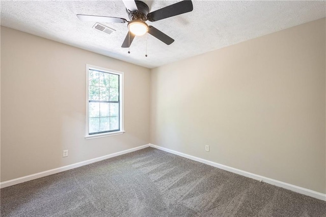 carpeted spare room with a textured ceiling, ceiling fan, visible vents, and baseboards