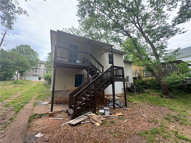 back of property with stairs