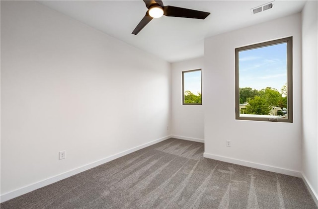 empty room with carpet floors and ceiling fan