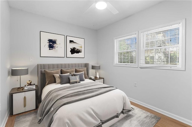 bedroom featuring wood-type flooring and ceiling fan