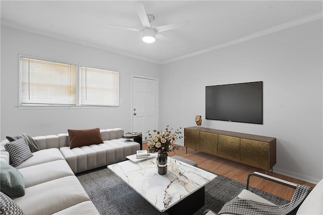 living room with ceiling fan, ornamental molding, and dark wood-type flooring