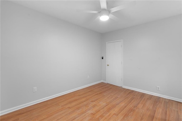 spare room with light hardwood / wood-style floors and ceiling fan