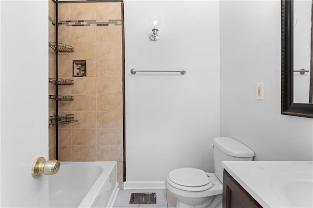 full bathroom featuring toilet, vanity, tiled shower / bath, and tile patterned flooring