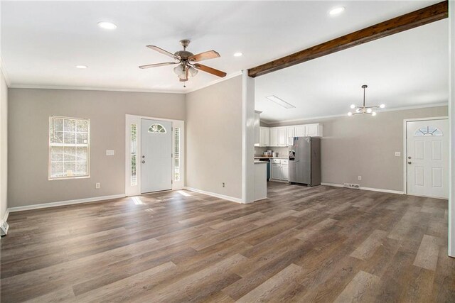 unfurnished living room with hardwood / wood-style floors, vaulted ceiling with beams, ornamental molding, and ceiling fan with notable chandelier