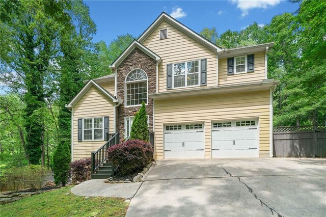 160 Wentworth Dr, Canton, GA 30114 - traditional home featuring driveway, fence, stone siding, and a garage