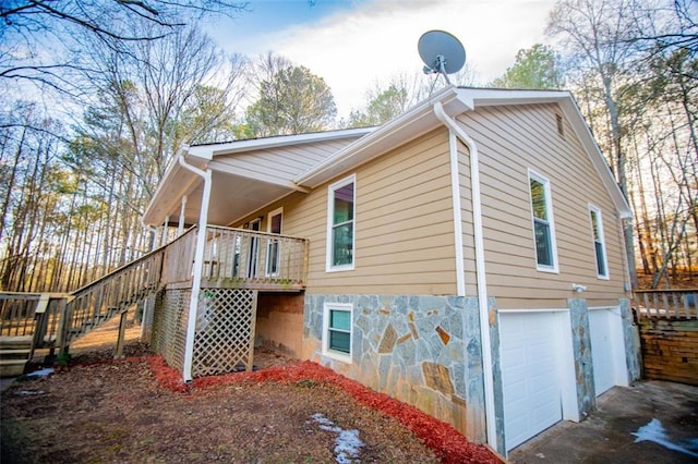 view of side of property with a garage