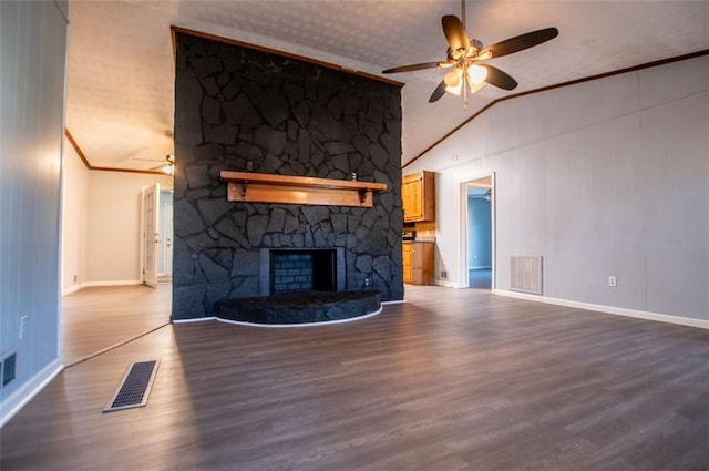 unfurnished living room featuring lofted ceiling, hardwood / wood-style flooring, crown molding, ceiling fan, and a fireplace