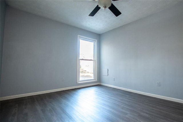 unfurnished room with ceiling fan, dark hardwood / wood-style floors, and a textured ceiling