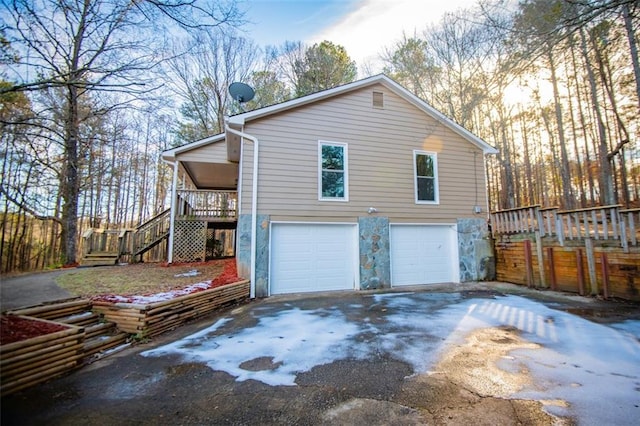 view of side of home featuring a garage