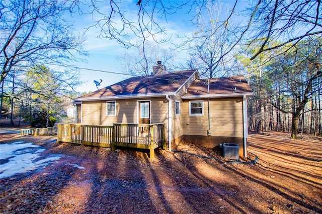 view of front of home with central air condition unit and a deck