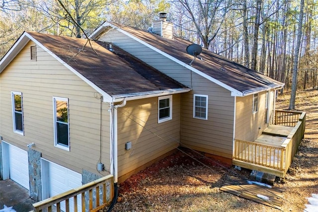 view of side of home with a garage