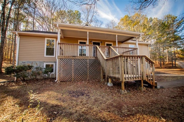 rear view of house with a deck