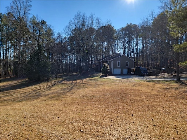 view of yard featuring a garage