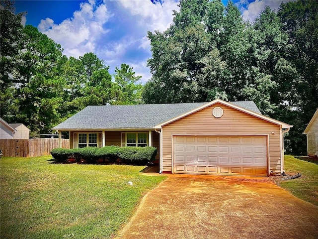 single story home featuring a garage and a front yard