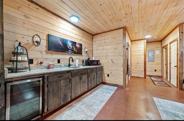 bar featuring wine cooler, electric panel, wood ceiling, wooden walls, and concrete floors