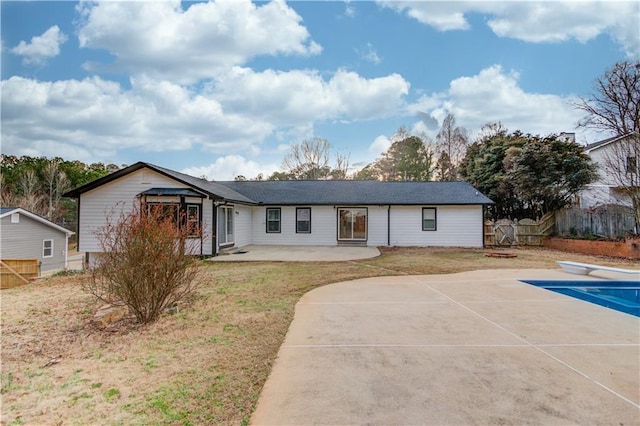 view of front of home with a patio and fence