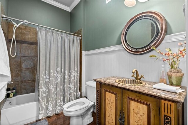 full bathroom with shower / tub combo, vanity, crown molding, wood-type flooring, and toilet