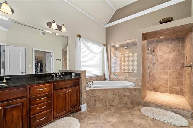 bathroom with vanity, lofted ceiling, tile patterned floors, crown molding, and independent shower and bath