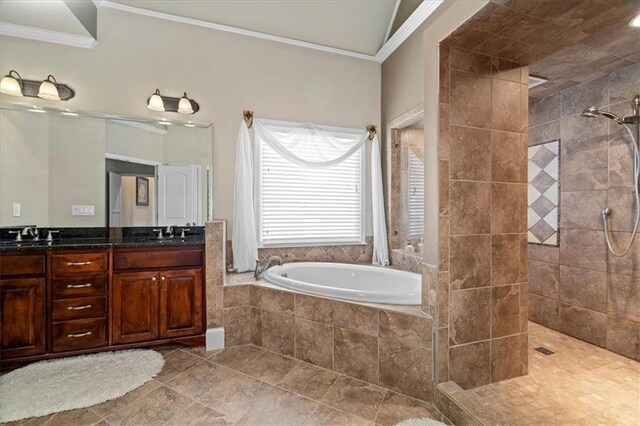 bathroom with tile patterned flooring, vanity, crown molding, and plus walk in shower