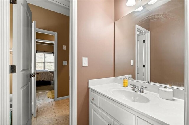 bathroom with tile patterned floors and vanity