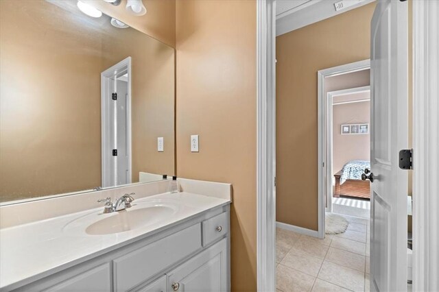 bathroom with vanity and tile patterned floors