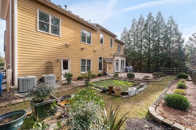 rear view of property with central air condition unit