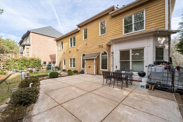 back of house with a patio