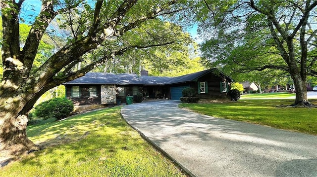 ranch-style home featuring a front yard